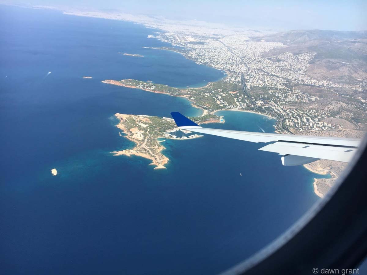 A photograph taken from a plane showing the outline of Greece in the Mediterranean.